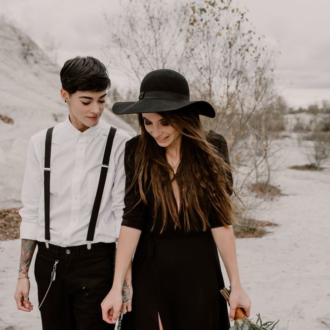 Bride in Portez Vos Idées Black Wedding Dress | Bride in Black Trousers, White Shirt &amp; Braces | Wild Same Sex Couple Wedding Inspiration Shoot | Anne Letournel Photography