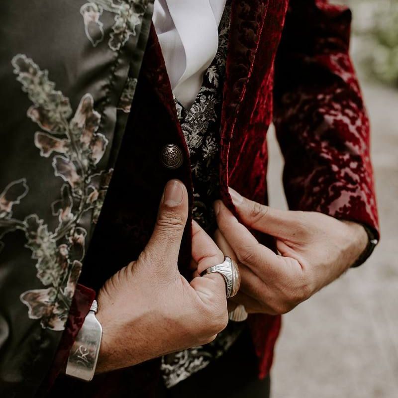Stylish groom patterned waistcoat and pink blazer