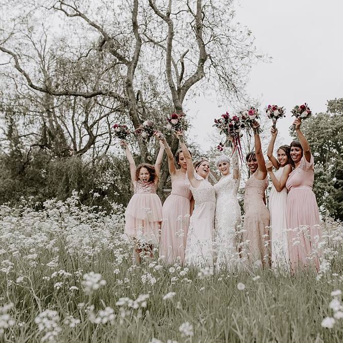 Bridal party portrait with bridesmaids in pink dresses