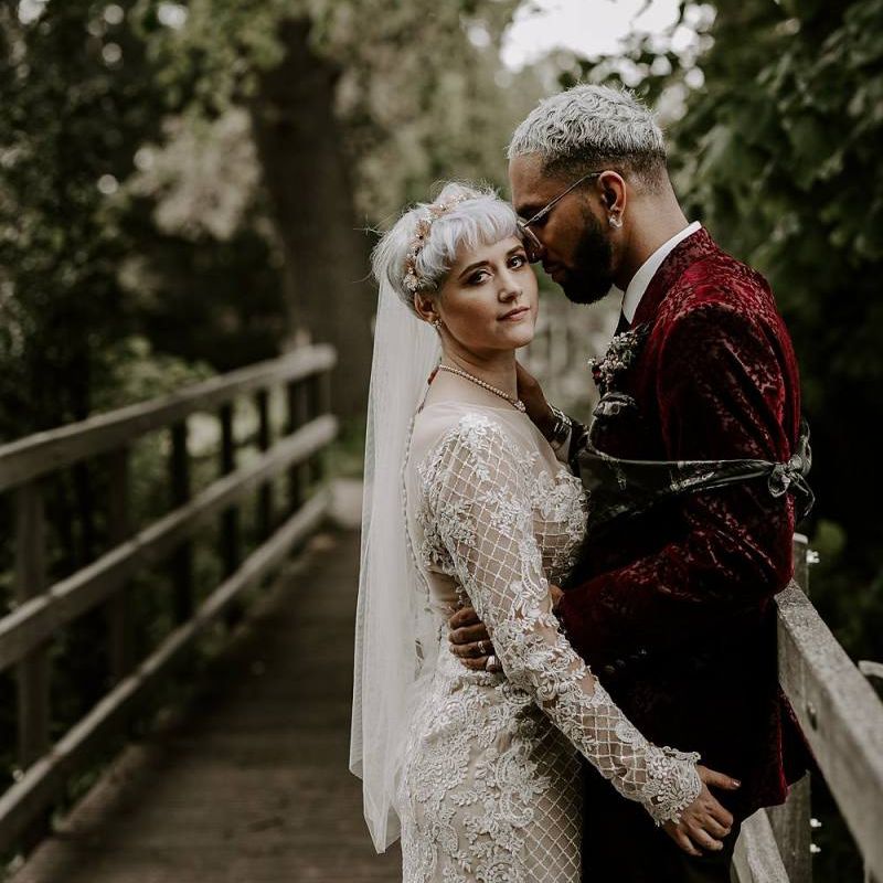 Bride in long sleeved Lillian West wedding dress