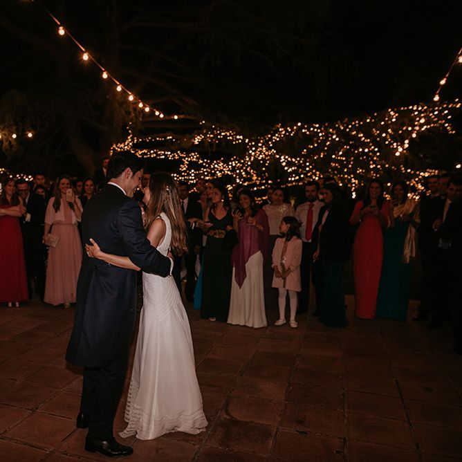 First Dance under Fairy Lights | Bride in Simple &amp; Elegant Teresa Helbig Wedding Dress  | Groom in Traditional Tails | Authentic Spanish Wedding at Masia Ribas, Barcelona | Sara Lobla Photography
