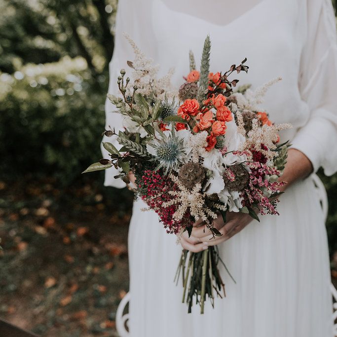 Bouquet With Orange Flowers // Bamboo Furniture For Destination Wedding In Spain With Planning From El Mono Con Sombrero With Images By AHR Photos Spanish Wedding Photography