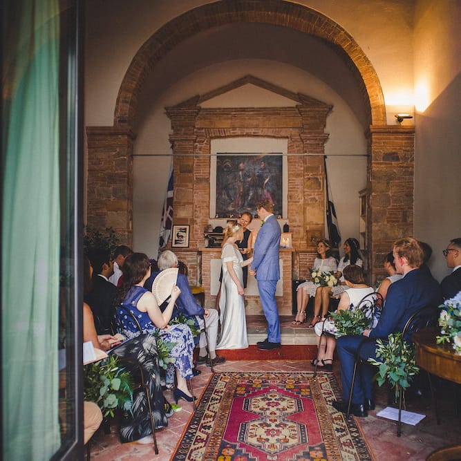 Intimate Prosecco Pool Party Wedding in Tuscany. Bride wears Livio Lacurre Gown, Groom wears Beggars Run Custom Suit. Photography by Livio Lacurre.