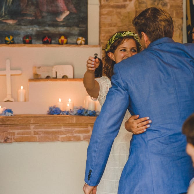 Intimate Prosecco Pool Party Wedding in Tuscany. Bride wears Livio Lacurre Gown, Groom wears Beggars Run Custom Suit. Photography by Livio Lacurre.