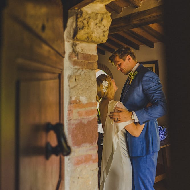 Intimate Prosecco Pool Party Wedding in Tuscany. Bride wears Livio Lacurre Gown, Groom wears Beggars Run Custom Suit. Photography by Livio Lacurre.
