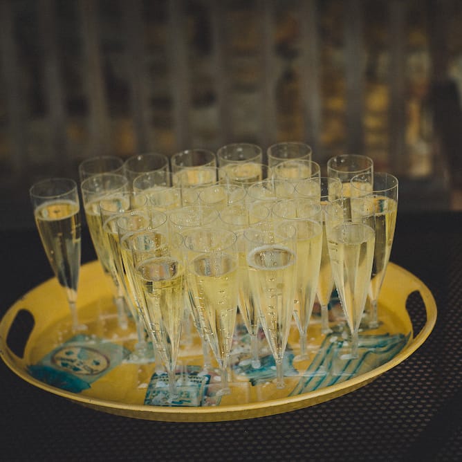 Intimate Prosecco Pool Party Wedding in Tuscany. Bride wears Livio Lacurre Gown, Groom wears Beggars Run Custom Suit. Photography by Livio Lacurre.