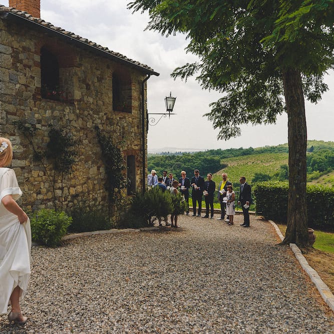 Intimate Prosecco Pool Party Wedding in Tuscany. Bride wears Livio Lacurre Gown, Groom wears Beggars Run Custom Suit. Photography by Livio Lacurre.