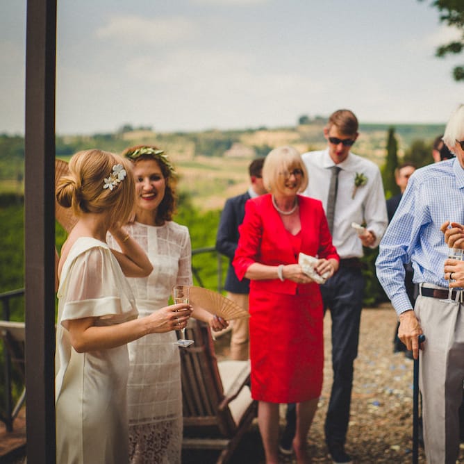 Intimate Prosecco Pool Party Wedding in Tuscany. Bride wears Livio Lacurre Gown, Groom wears Beggars Run Custom Suit. Photography by Livio Lacurre.