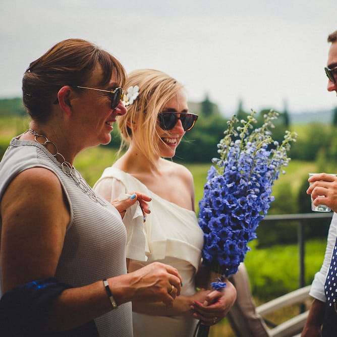 Flowers by Stiatti Fiori. Intimate Prosecco Pool Party Wedding in Tuscany. Bride wears Livio Lacurre Gown, Groom wears Beggars Run Custom Suit. Photography by Livio Lacurre.