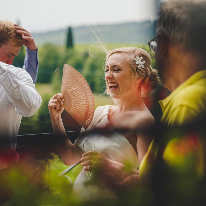 Intimate Prosecco Pool Party Wedding in Tuscany. Bride wears Livio Lacurre Gown, Groom wears Beggars Run Custom Suit. Photography by Livio Lacurre.