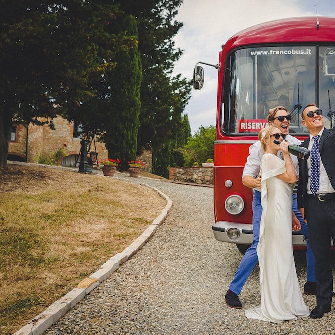 Vintage Bus Wedding Transport from Drive in Style. Intimate Prosecco Pool Party Wedding in Tuscany. Bride wears Livio Lacurre Gown, Groom wears Beggars Run Custom Suit. Photography by Livio Lacurre.