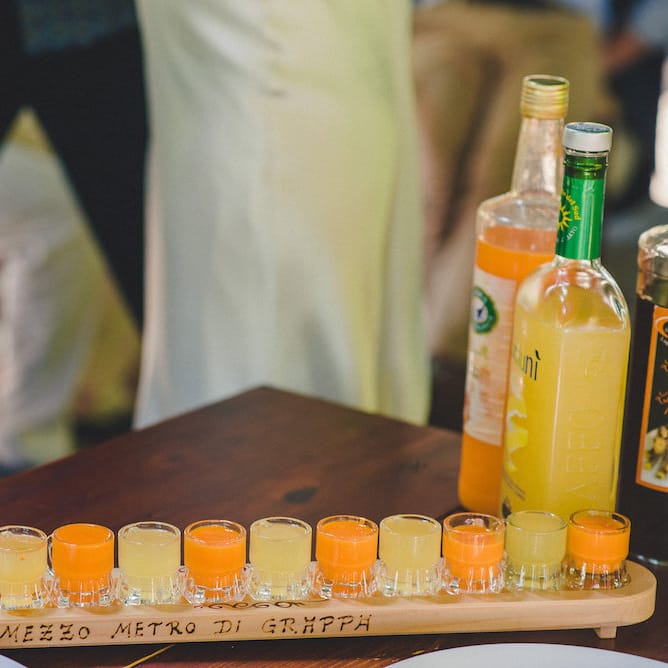 Intimate Prosecco Pool Party Wedding in Tuscany. Bride wears Livio Lacurre Gown, Groom wears Beggars Run Custom Suit. Photography by Livio Lacurre.