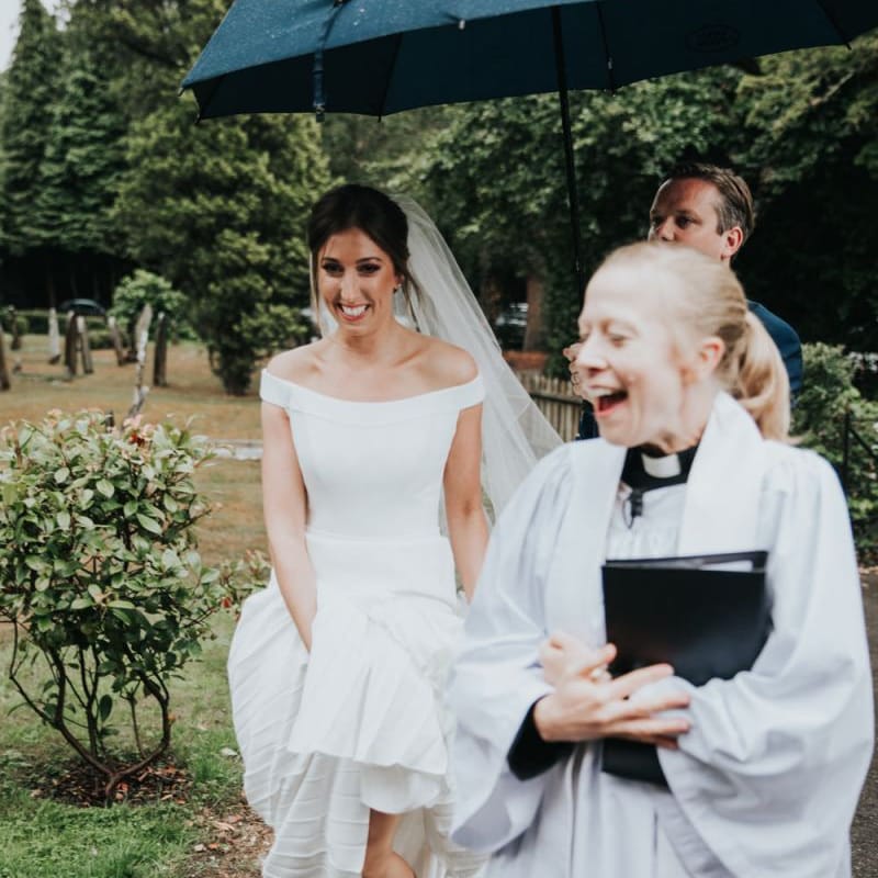 Bride in Suzanne Neville wedding dress arriving at church