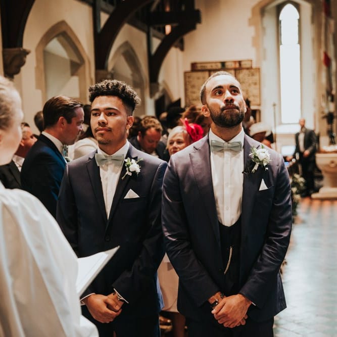 Groom waits for bride to walk down the aisle