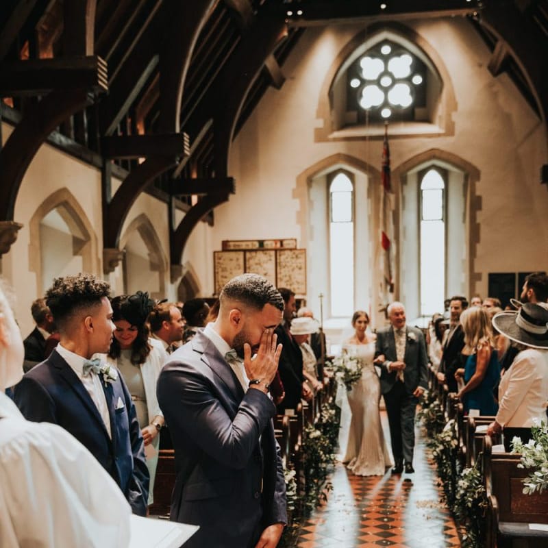 Emotional groom as he sees bride