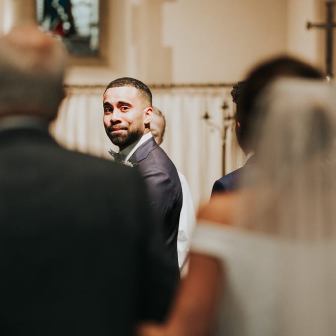Emotional groom as he sees bride