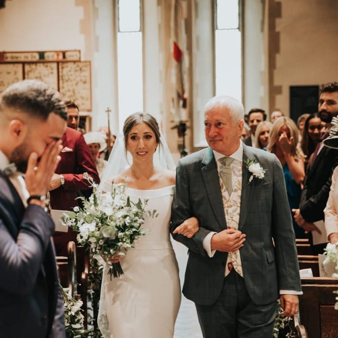 Emotional groom as he sees bride