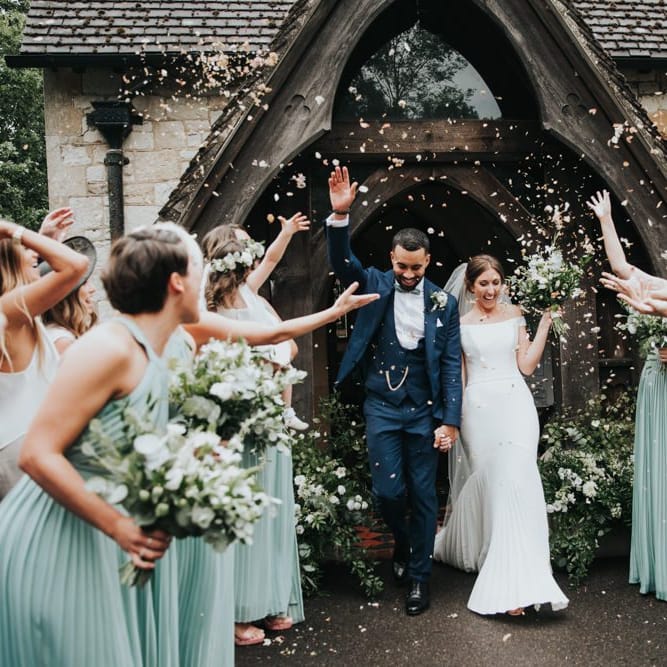 Confetti exit for bride and groom at church ceremony