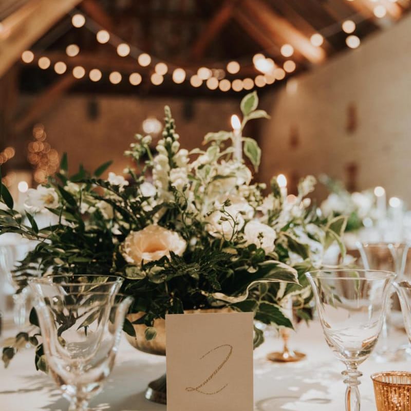 White wedding flower table decor at Bury Court Barn