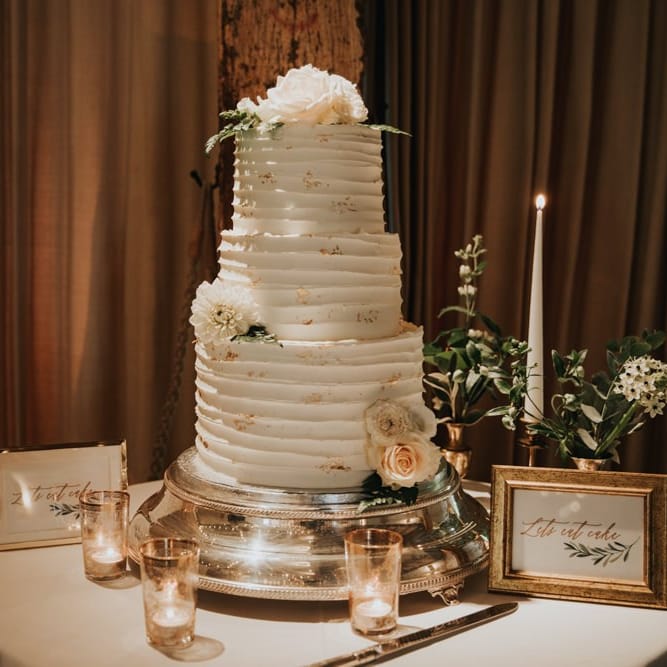 Rustic white wedding cake at Bury Court Barn