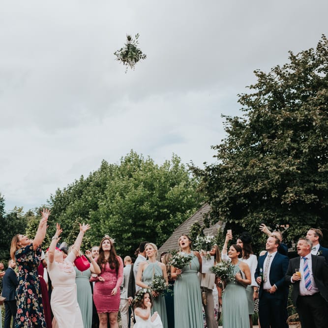 Bouquet toss at Bury Court Barn wedding