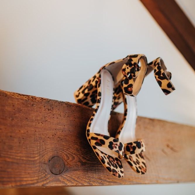 Brides leopard print heels at outdoor spring wedding