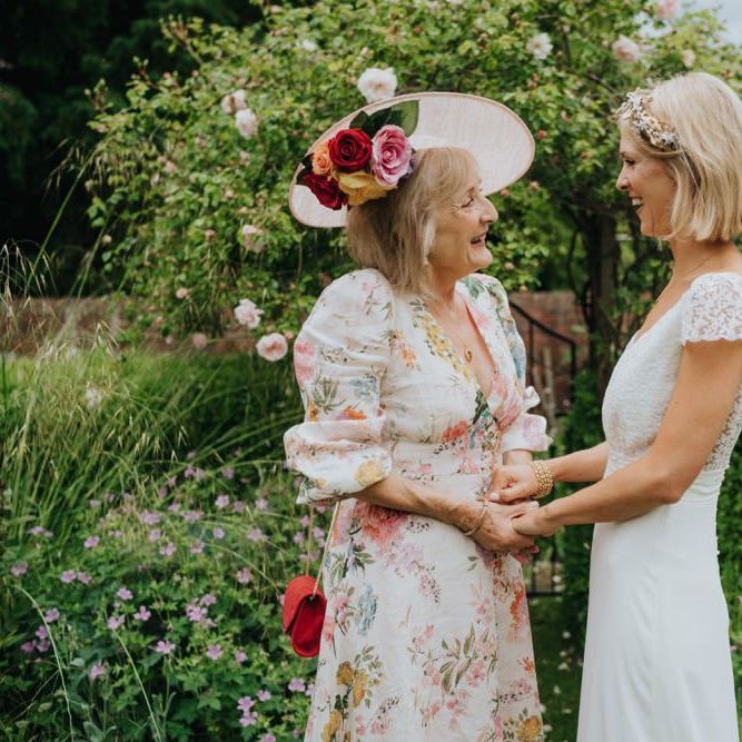 Bride wearing a beautiful laced top bridal dress and gold embellished headband at Newburgh Priory