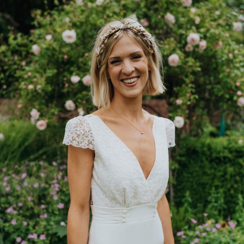 Bride wearing a beautiful laced top bridal dress and gold embellished headband at Newburgh Priory