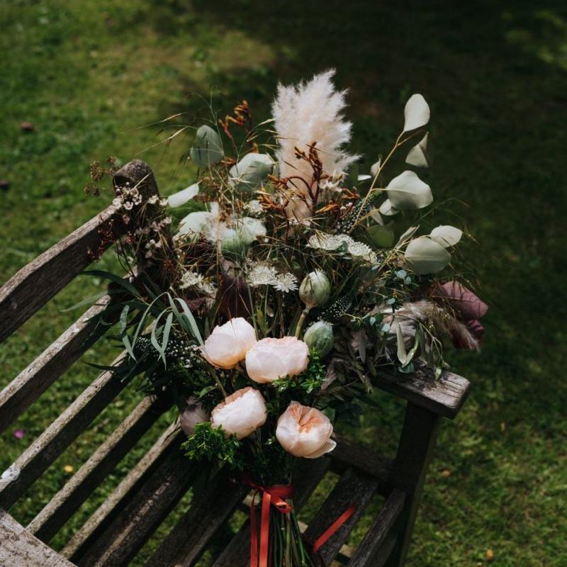 Beautiful floral and pampas grass bouquet tied with ribbon