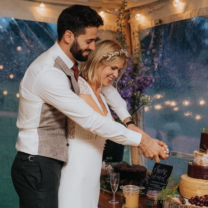 Bride and groom cut the cheese cake