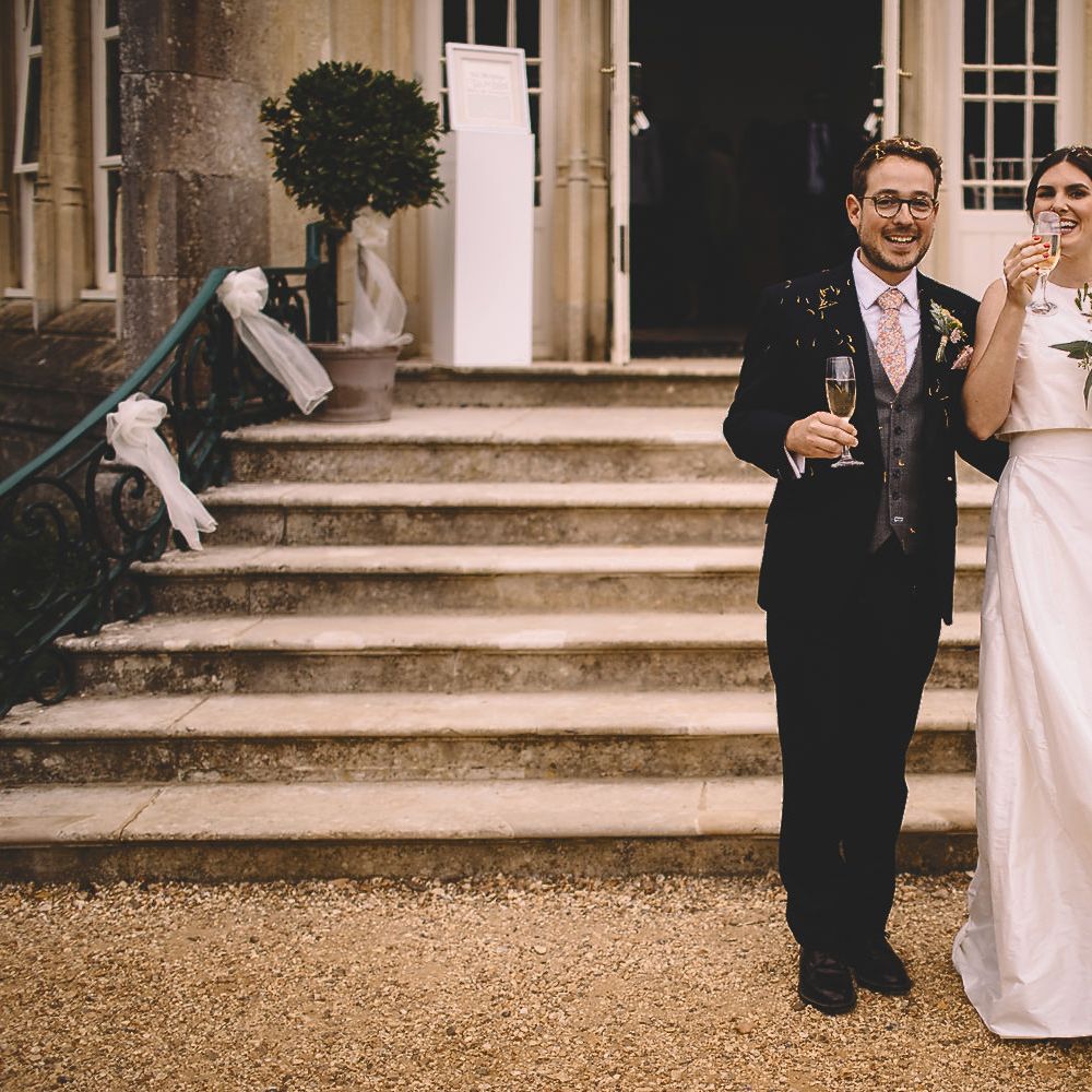 Bride in Homemade Wedding Dress and Groom in Dress2Kill Suit Just Married