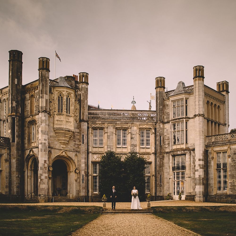 Bride and Groom in Front of Highcliffe Castle in Dorset