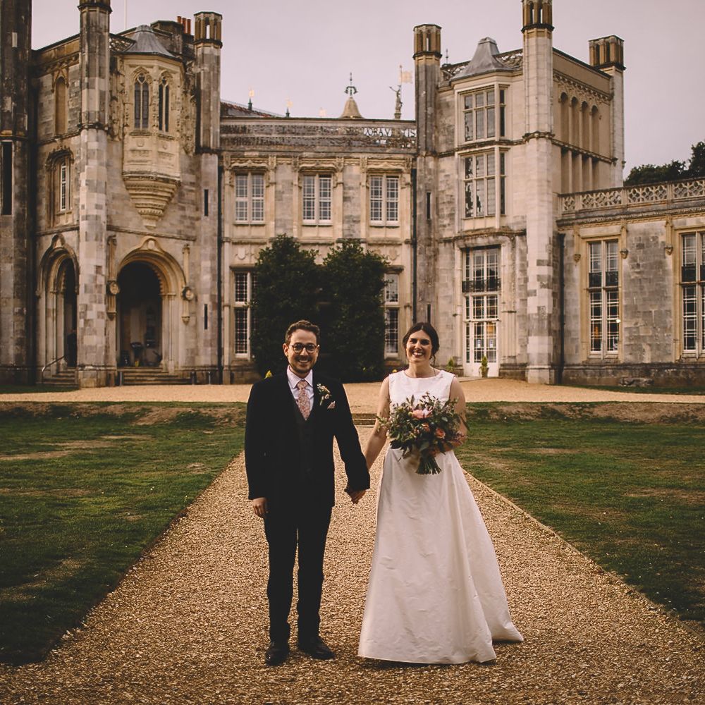 Bride and Groom in Front of Highcliffe Castle in Dorset
