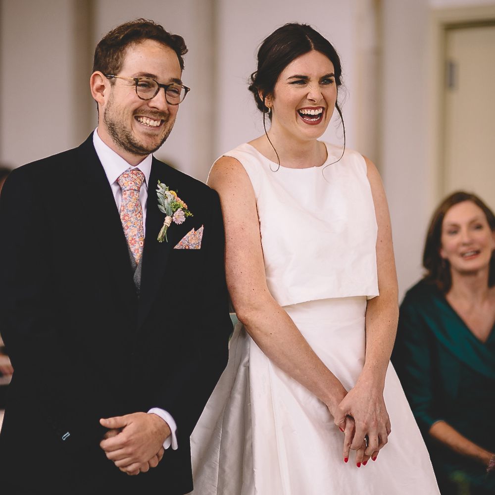 Bride and Groom Laughing During The Wedding Ceremony