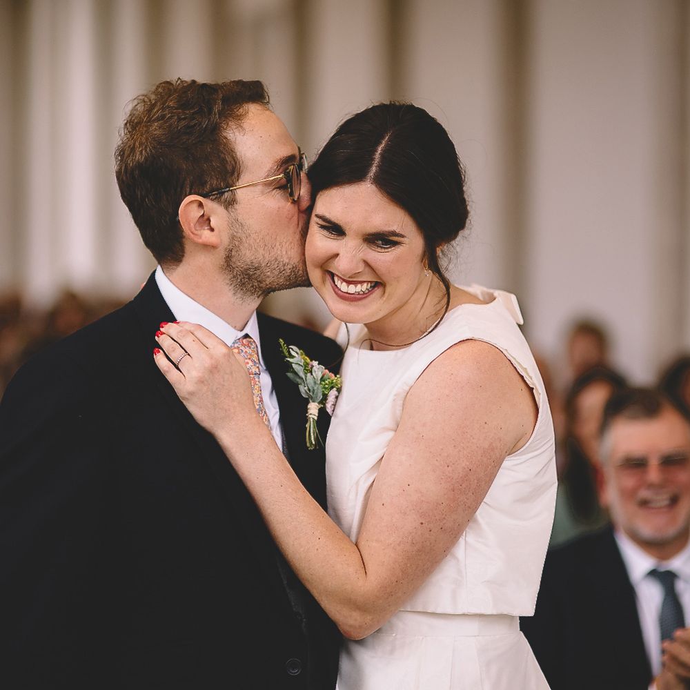 Groom Kissing His Bride During The Wedding Ceremony