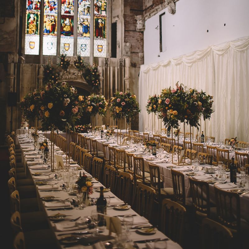 Wedding Reception at Highcliffe Castle with Stain Glass Windows and Tall Centrepieces