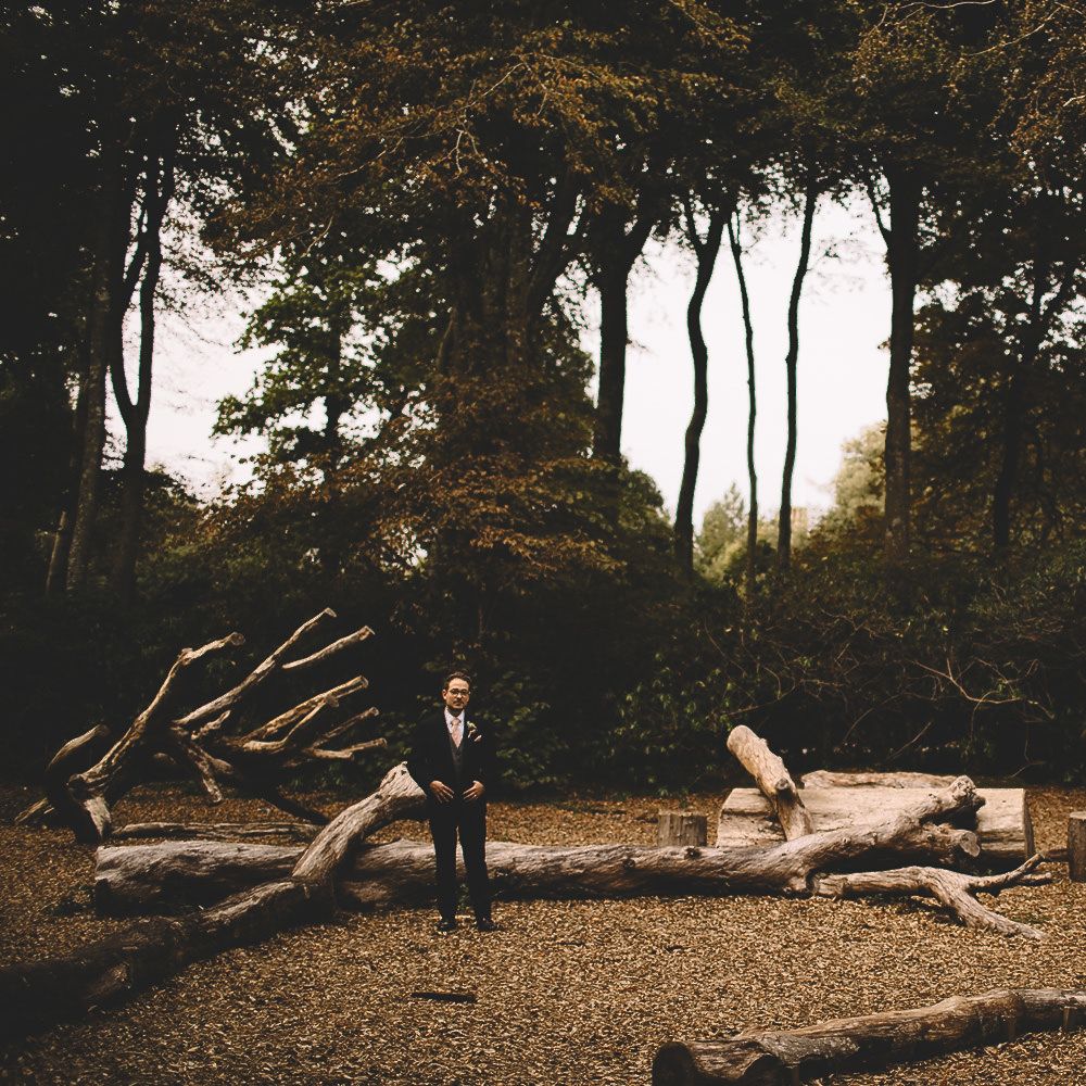 Bride in Homemade Wedding Dress with Layered Top and Bow Back and Groom in Dress2Kill Suit