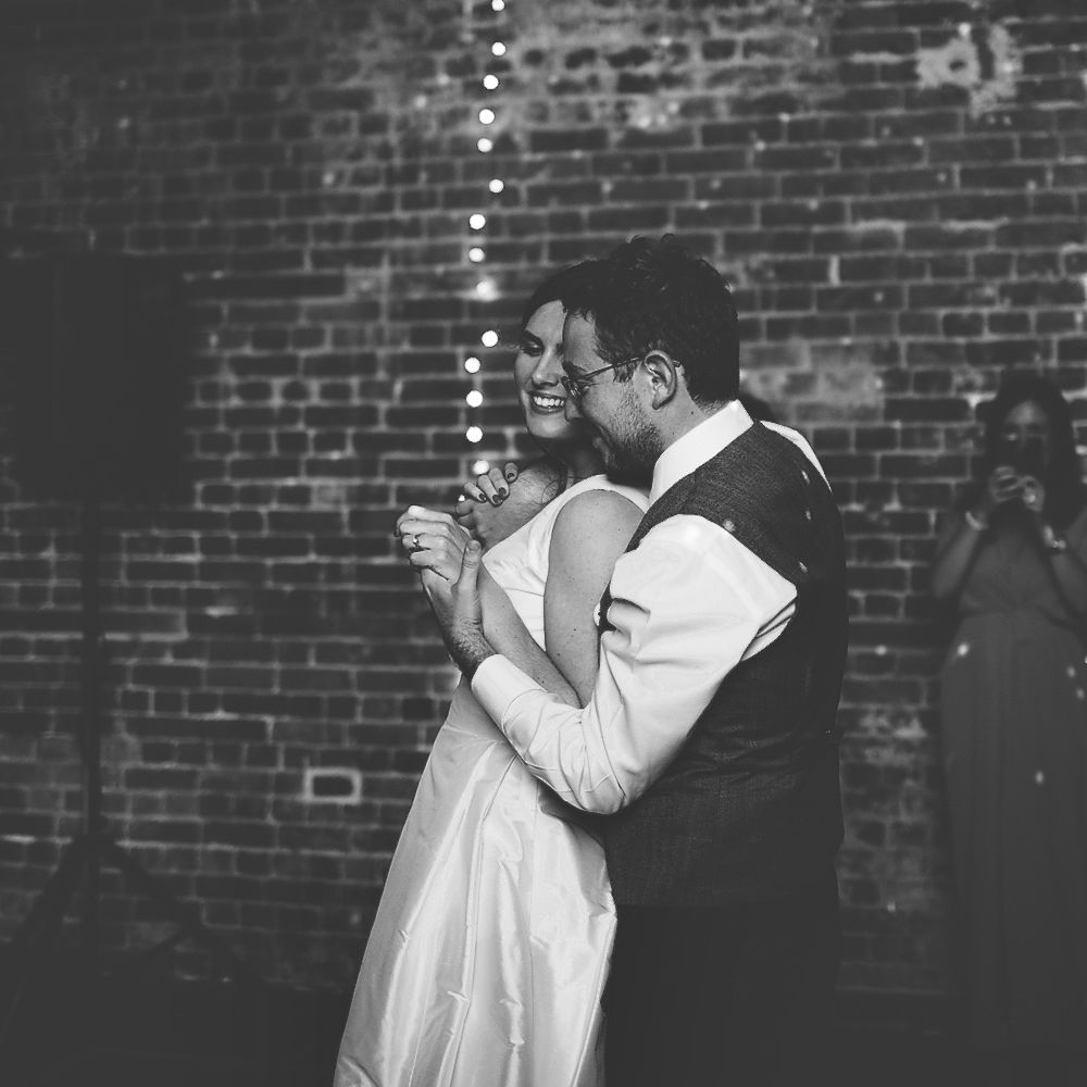 Bride and Groom Dancing with Fairylight Backdrop