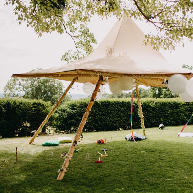 Naked Tipi Shaded Area with Giant Balloons Wedding Decor | DIY Rustic Tipi Wedding at Riverhill Gardens, Sevenoaks | Frances Sales Photography