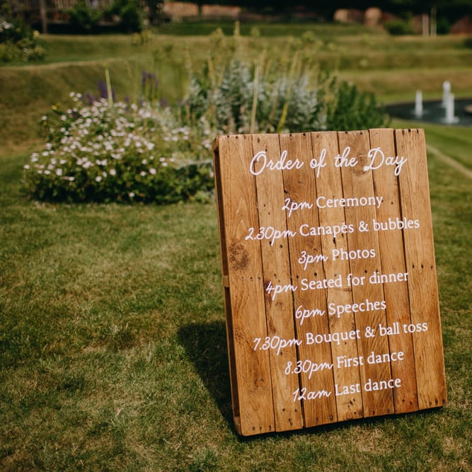 Wooden Order of the Day Wedding Sign | DIY Rustic Tipi Wedding at Riverhill Gardens, Sevenoaks | Frances Sales Photography
