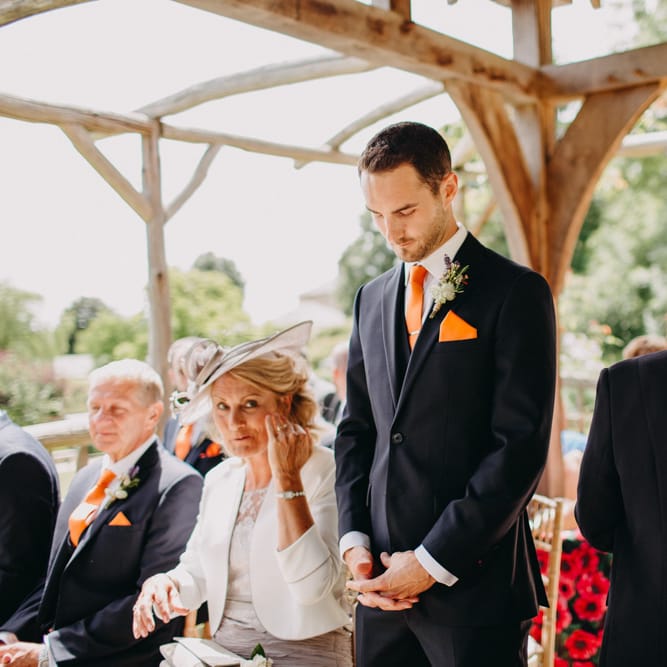 Groom in Moss Bros. Suit at the Altar | DIY Rustic Tipi Wedding at Riverhill Gardens, Sevenoaks | Frances Sales Photography