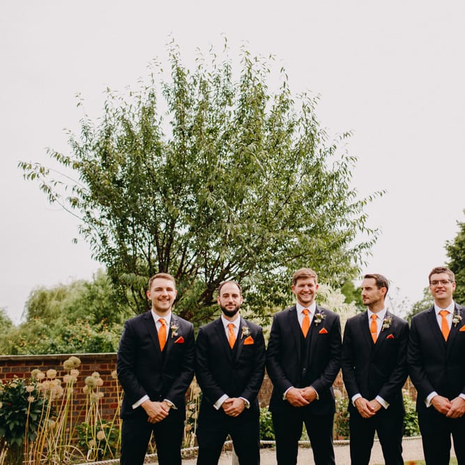 Groomsmen in Moss Bros. Suits &amp; Orange Ties | DIY Rustic Tipi Wedding at Riverhill Gardens, Sevenoaks | Frances Sales Photography