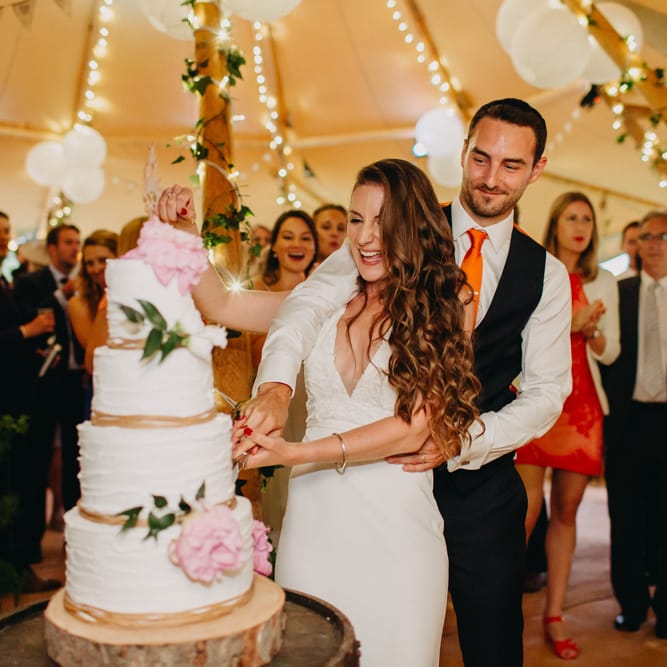 Cutting the Wedding Cake | Bride in Halo &amp; Wren Wedding Dress | Groom in Moss Bros. Suit | DIY Rustic Tipi Wedding at Riverhill Gardens, Sevenoaks | Frances Sales Photography