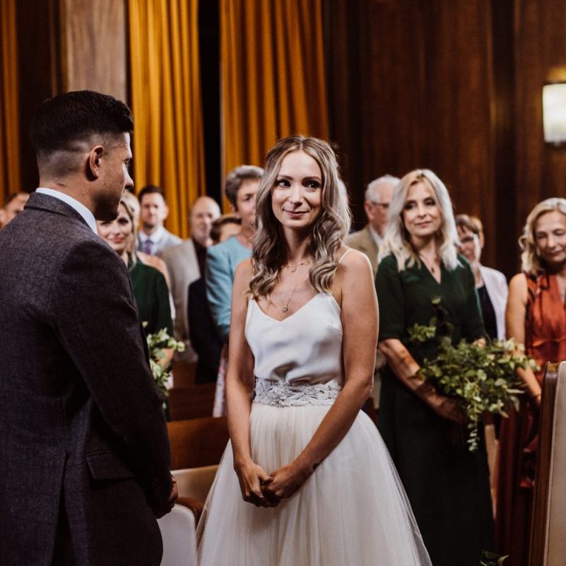 Bride wearing two piece Halfpenny London dress with  belt at Stoke Newington Town Hall