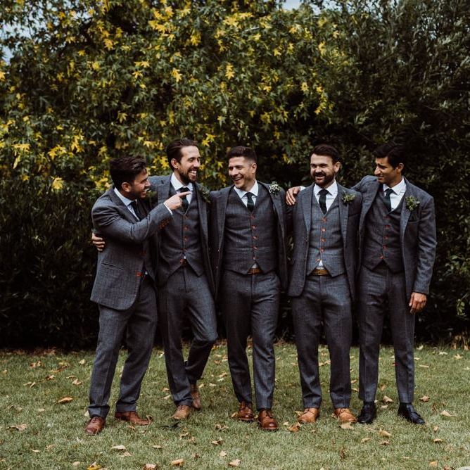 Groom and his groomsmen wearing grey three piece suits with brown shoes at 'Peaky Blinder' styled wedding