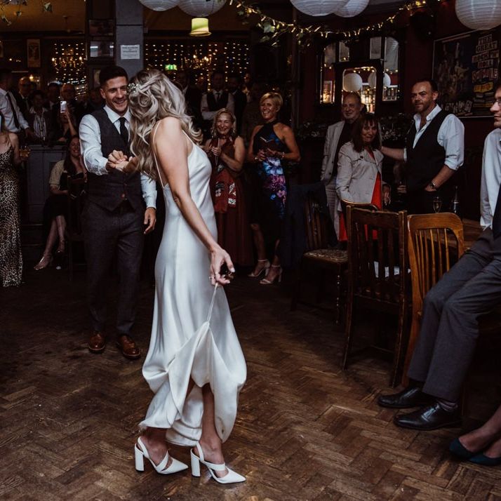 Bride and grooms first dance at pub reception