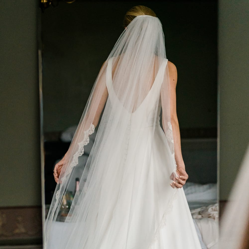 Elegant Bride in Caroline Castigliano Wedding Dress with Buttons on the Back | Traditional Green/Blue Danish Wedding at Scandinavian Country House, Jomfruens Egede in Faxe, Denmark | John Barwood Photography