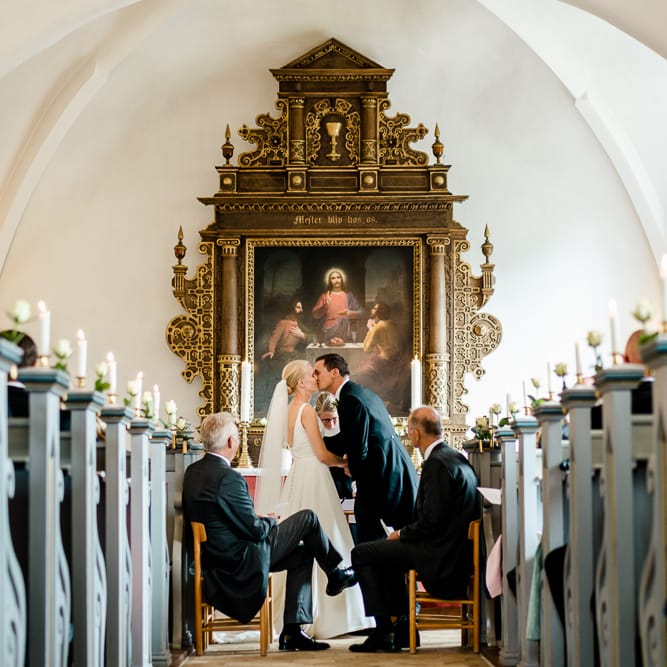 Church Wedding Ceremony | Bride in Caroline Castigliano Wedding Dress | Groom in Henry Herbert Tailors Morning Suit | Traditional Green/Blue Danish Wedding at Scandinavian Country House, Jomfruens Egede in Faxe, Denmark | John Barwood Photography