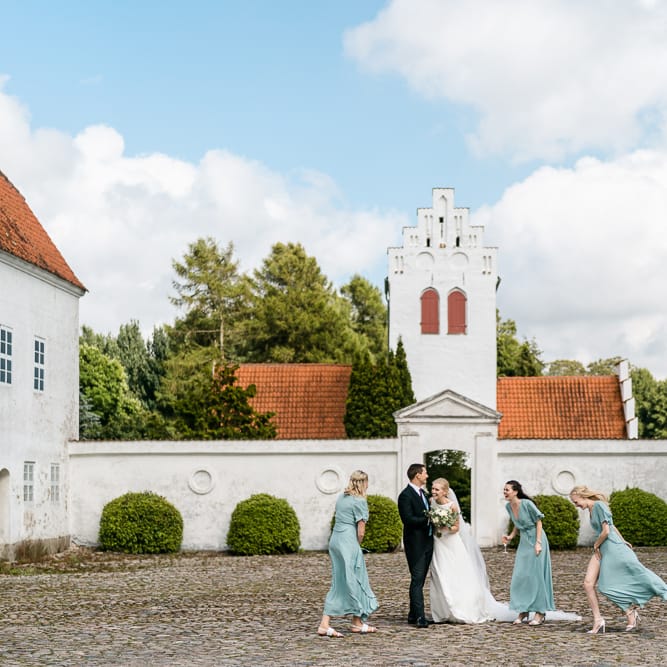Bridal Party | Bridesmaids in Wrap ReWritten Dresses | Elegant Bride in Caroline Castigliano Wedding Dress | Traditional Green/Blue Danish Wedding at Scandinavian Country House, Jomfruens Egede in Faxe, Denmark | John Barwood Photography
