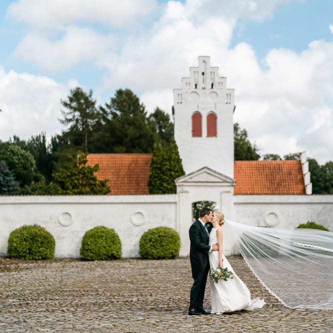 Bride in Caroline Castigliano Wedding Dress | Groom in Henry Herbert Tailors Morning Suit | Traditional Green/Blue Danish Wedding at Scandinavian Country House, Jomfruens Egede in Faxe, Denmark | John Barwood Photography